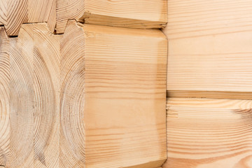 Wood Glued timber close up. Wooden grain timber end background. Glued pine timber beams. Wood for building a house. Building materials made of wood. Glued beams. Wooden beams in the groove