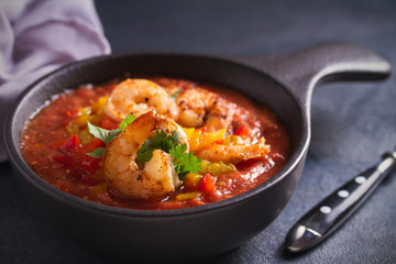 Shrimp Gazpacho with Roasted Red and Yellow Bell Peppers. Spanish pureed cold tomato soup with shrimps