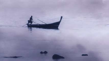 Asian fisherman returning in the evening