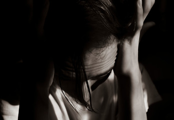 Obraz premium Fragment of the face of a young guy in a dark room