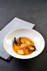 Tom Yam kung Spicy Thai soup with shrimp, seafood in bowl copy space