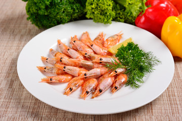 shrimp on a white plate, greens and vegetables, menu concept