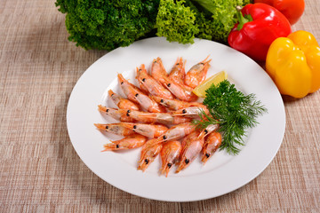 shrimp on a white plate, greens and vegetables, menu concept