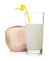 Glass of drink and peeled coconut on white background