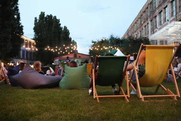 Foto auf Leinwand Modern open air cinema with comfortable seats in public park © New Africa
