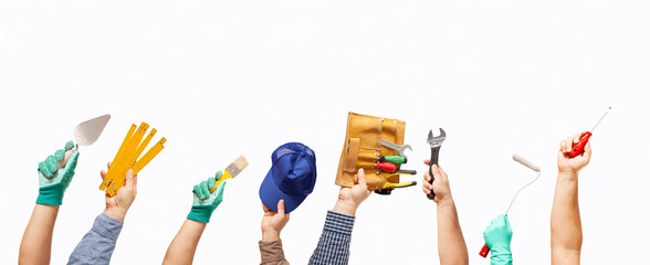 hands up with tools and brushes