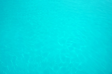 Fototapeta na wymiar Surface of swimming pool with clean blue water as background