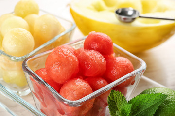 Melon and watermelon balls with mint served on table, closeup