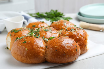 Traditional Ukrainian garlic bread (Pampushky) on table, closeup
