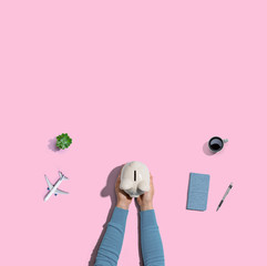 Person holding a piggy bank from above