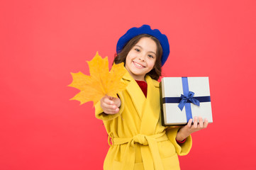 Feeling great. happy small girl with maple leaf and present box. girl child in french beret hold gift. Autumn weather change. thanksgiving day. fall season. school shopping sales. autumn kid fashion