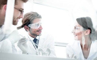 Group of scientists working on an experiment at the laboratory