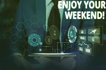 Writing note showing Enjoy Your Weekend. Business concept for wishing someone that something nice will happen at holiday Male wear formal suit presenting presentation smart device