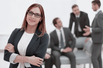 business woman standing with arms folded