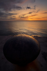 circle old pin in dock at huahin thailand in morning twilight skyline with seascape