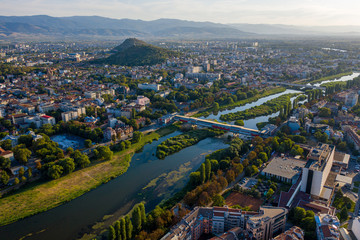 Aerial view of Plovdiv and Maritza river with blue skies and water