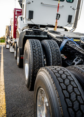 Fototapeta premium Big rig semi truck transports new semi trucks tractor loaded on top of one another