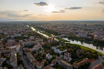 Fototapeta premium Aerial view of Plovdiv with hills and Maritsa river during sunset