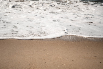 Foamy Water Edging onto Shore