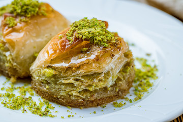 baklava Dilber with pistachios on wooden table. Turkish cuisine
