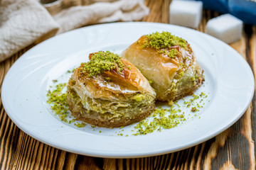 baklava Dilber with pistachios on wooden table. Turkish cuisine