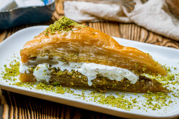 baklava with ice cream turkish cuisine on wooden table