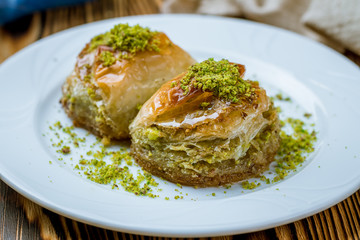 baklava Dilber with pistachios on wooden table. Turkish cuisine