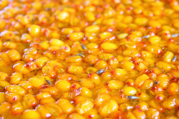 Fresh sea buckthorn jam. Close-up. Background. Texture.