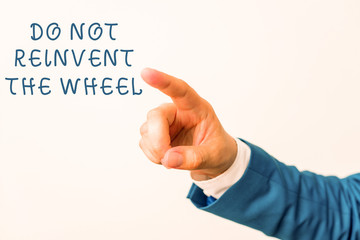 Word writing text Do Not Reinvent The Wheel. Business photo showcasing stop duplicating a basic method previously done Isolated hand pointing with finger. Business concept pointing finger