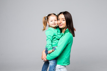 Mother holding her doughter in hands isolated on white background