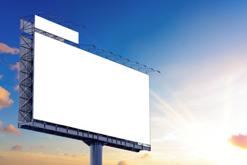 Obraz premium Blank billboard mockup with white screen against clouds and sunset with sunlight background. Copy space banner for advertisement. Business Concept.