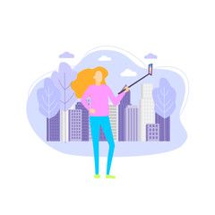 girl with a selfie stick. girl makes selfie on the background of the city