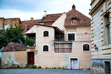 colorful houses in the medieval town of Sighisoara, Transylvania, Romania - touristic destination