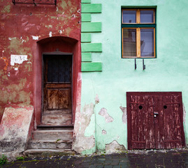 colorful houses in the medieval town of Sighisoara, Transylvania, Romania - touristic destination
