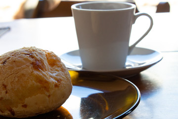 Brazilian cheese bread and a cup of coffee