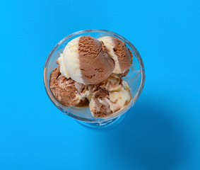 top view chocolate and vavanilla flavors ice cream balls in a cup