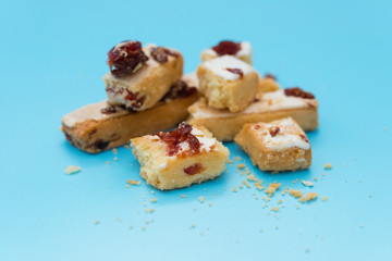 sweet pastry with cranberry on blue background