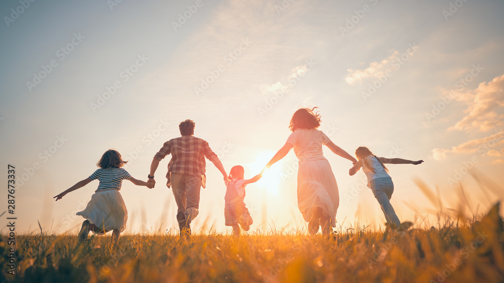 Wall mural Happy family on autumn walk