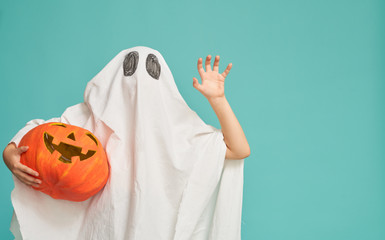 little kid in ghost costume