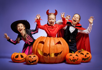 witch, Dracula and devil with pumpkins