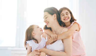 girls and their mother enjoy sunny morning