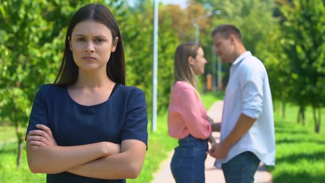 Envious girl jealous of her best friend with boyfriend, thinking about break-up