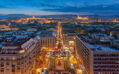 Budapest evening cityscape at Christmas time. Advent market is on the foreground. Buda royal castle...