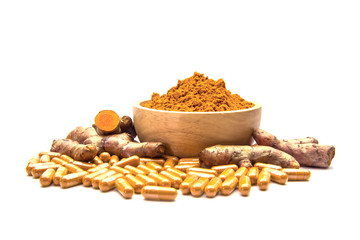 Raw Turmeric (Curcuma longa Linn) herbal,curcuma powder in wooden cup and turmeric capsules isolated on white Background.