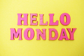Hello Monday alphabet letters on yellow background