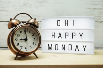 Happy Monday lightbox alphabet wording on wooden background