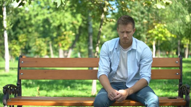 Desperate man holding girlfriends hand walking away, break-up and divorce