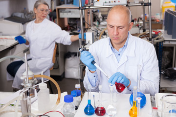 Chemist analyzing liquid samples