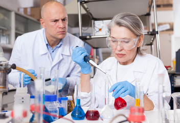 Fototapeta premium Scientists mixing reagents