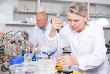 Female scientist working with reagents